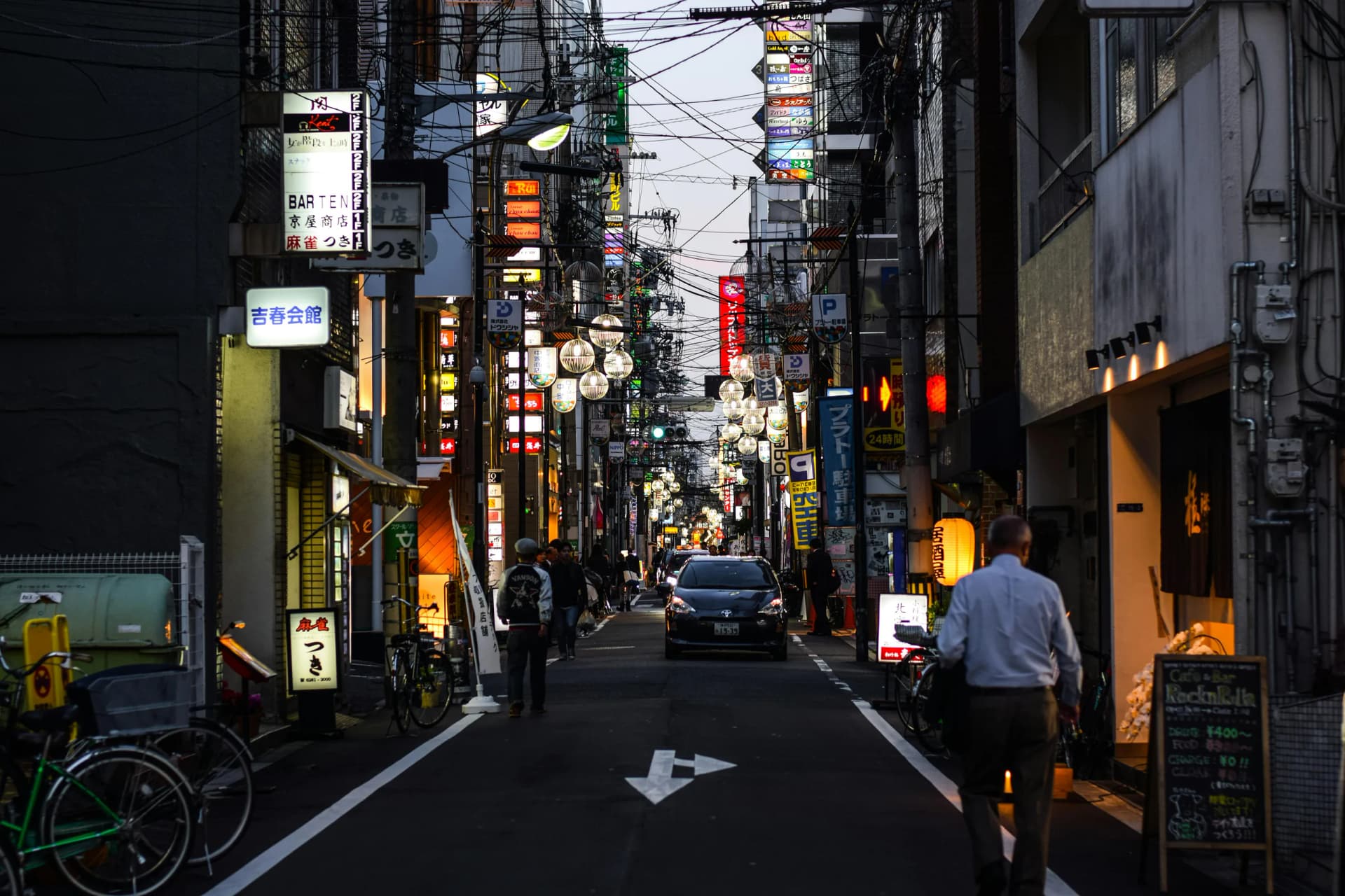 Street scene in Japan with local transportation nearby