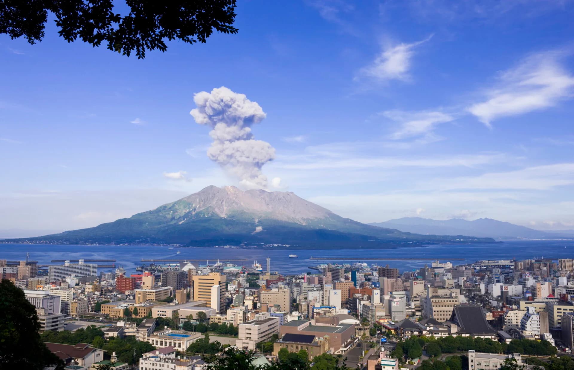 Sakurajima erupting across the bay from Kagoshima city