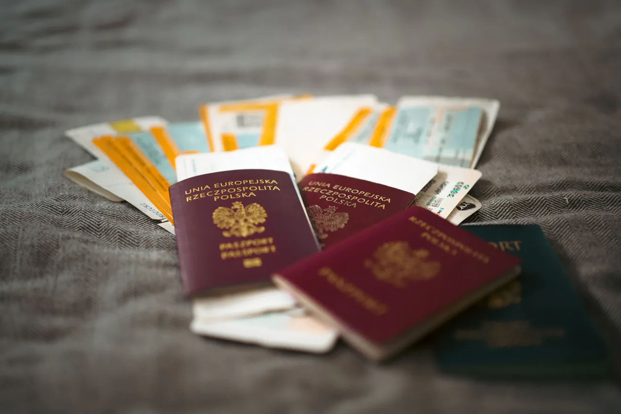Passports and travel documents arranged on a fabric surface
